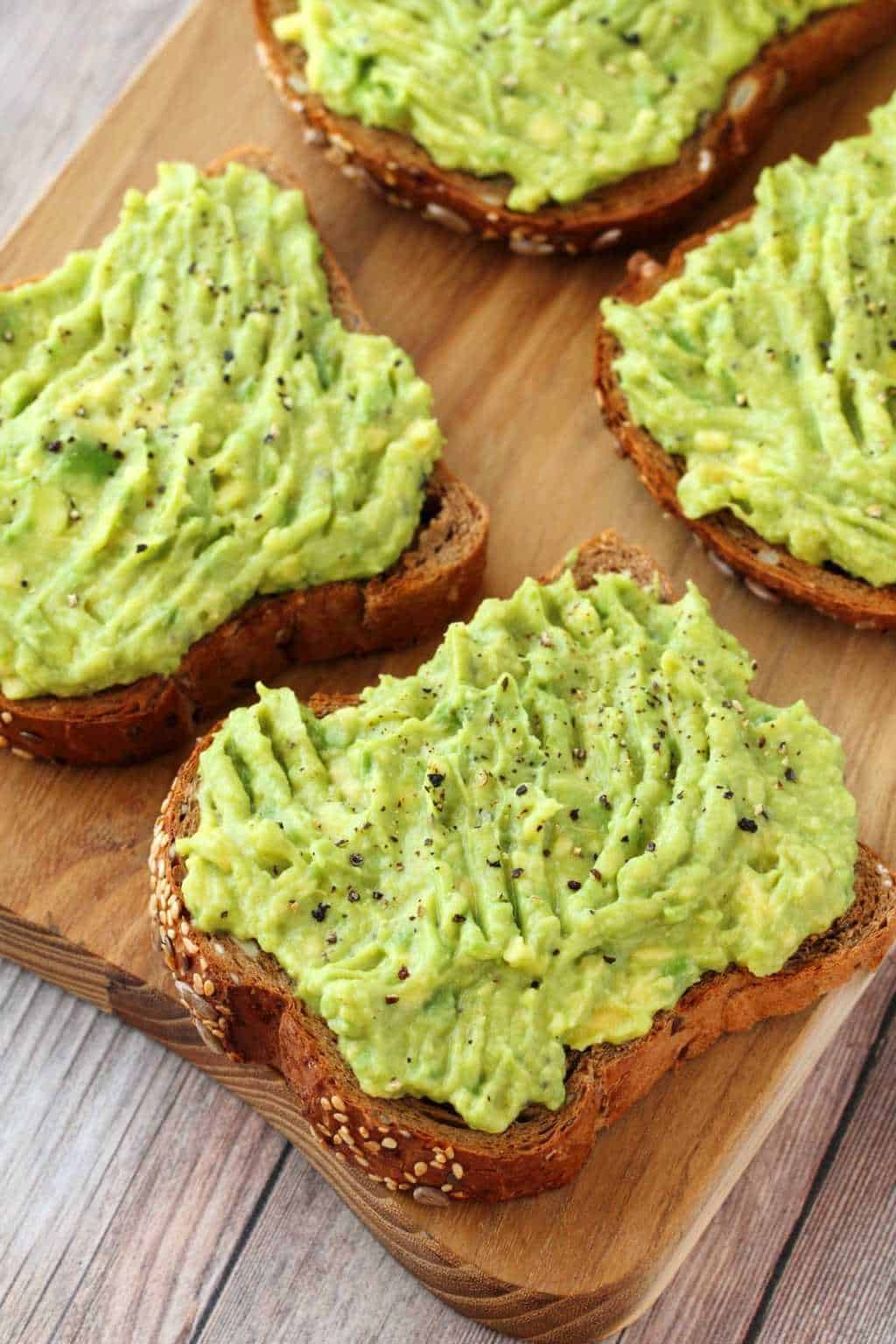 Avocado toast topped with black pepper. 