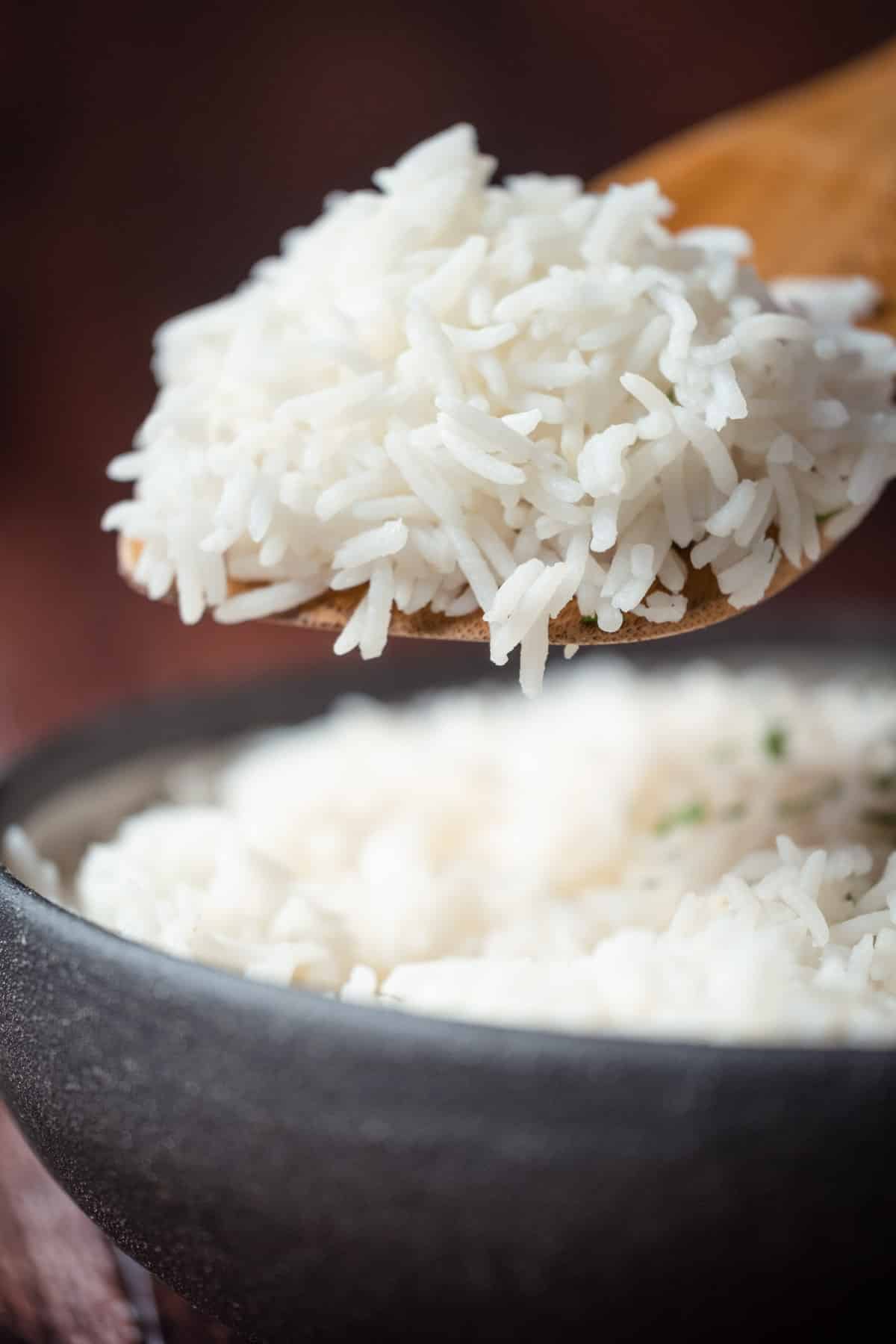 Wooden spoonful of basmati rice.