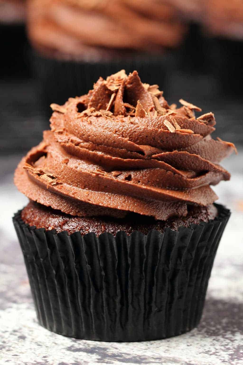 Classic vegan chocolate cupcakes topped with vegan chocolate buttercream and chocolate shavings. 