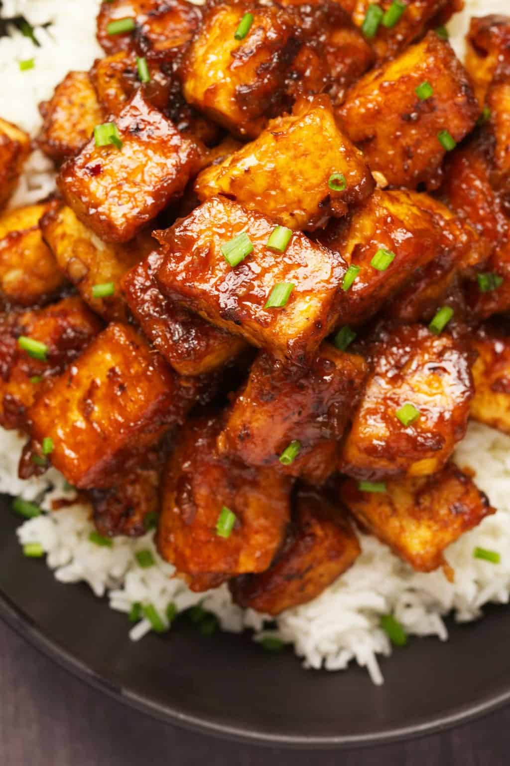General Tso's tofu served with basmati rice and chopped chives. 