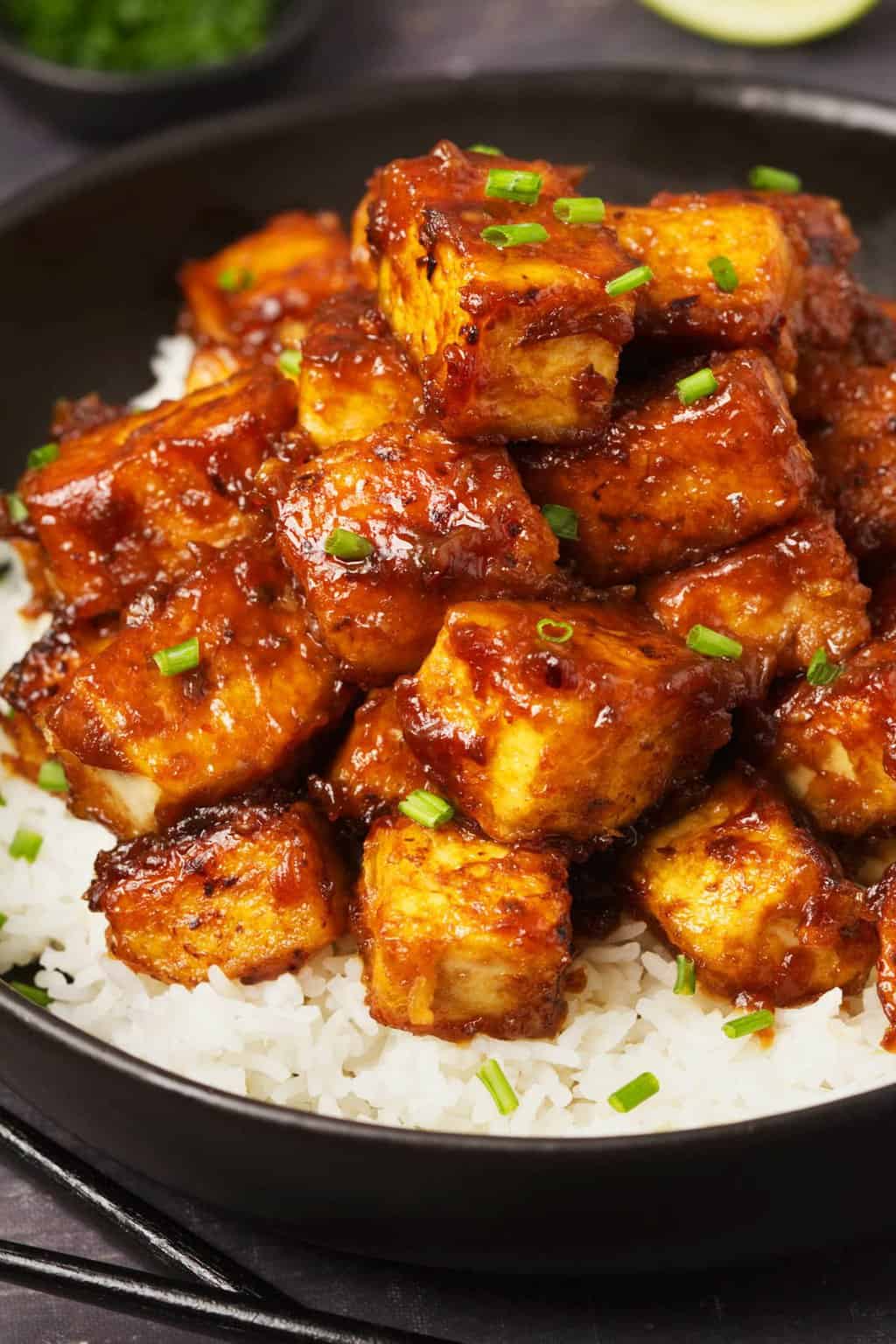 General Tso's tofu served over basmati rice with chopped chives. 