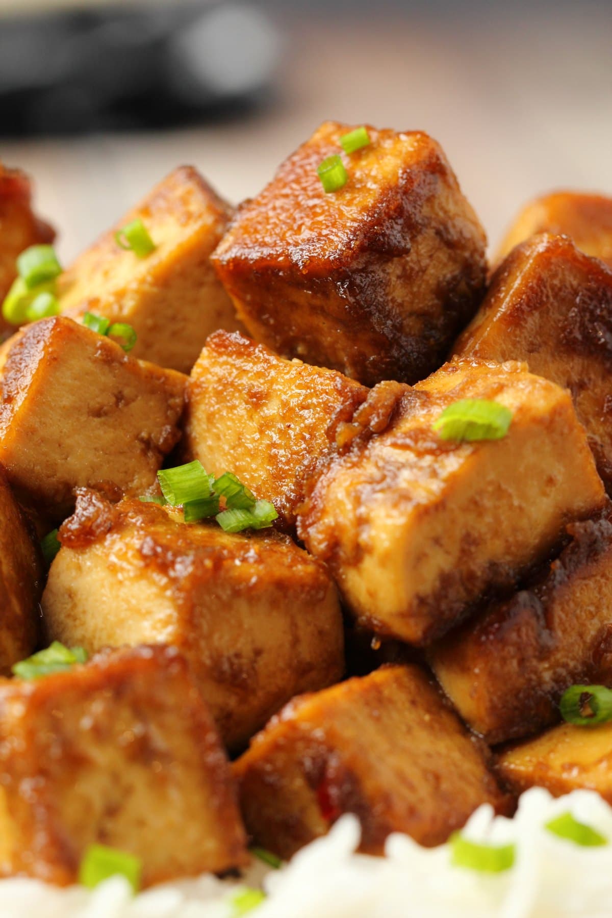 Marinated tofu topped with chopped chives. 