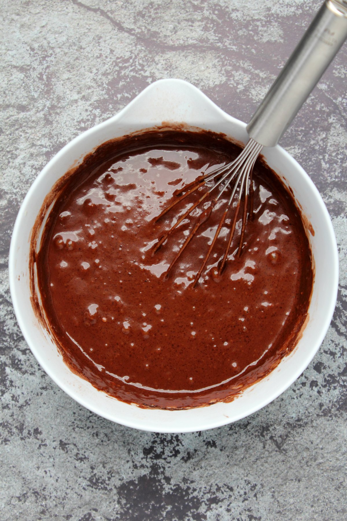 Vegan chocolate cake batter in a mixing bowl. 