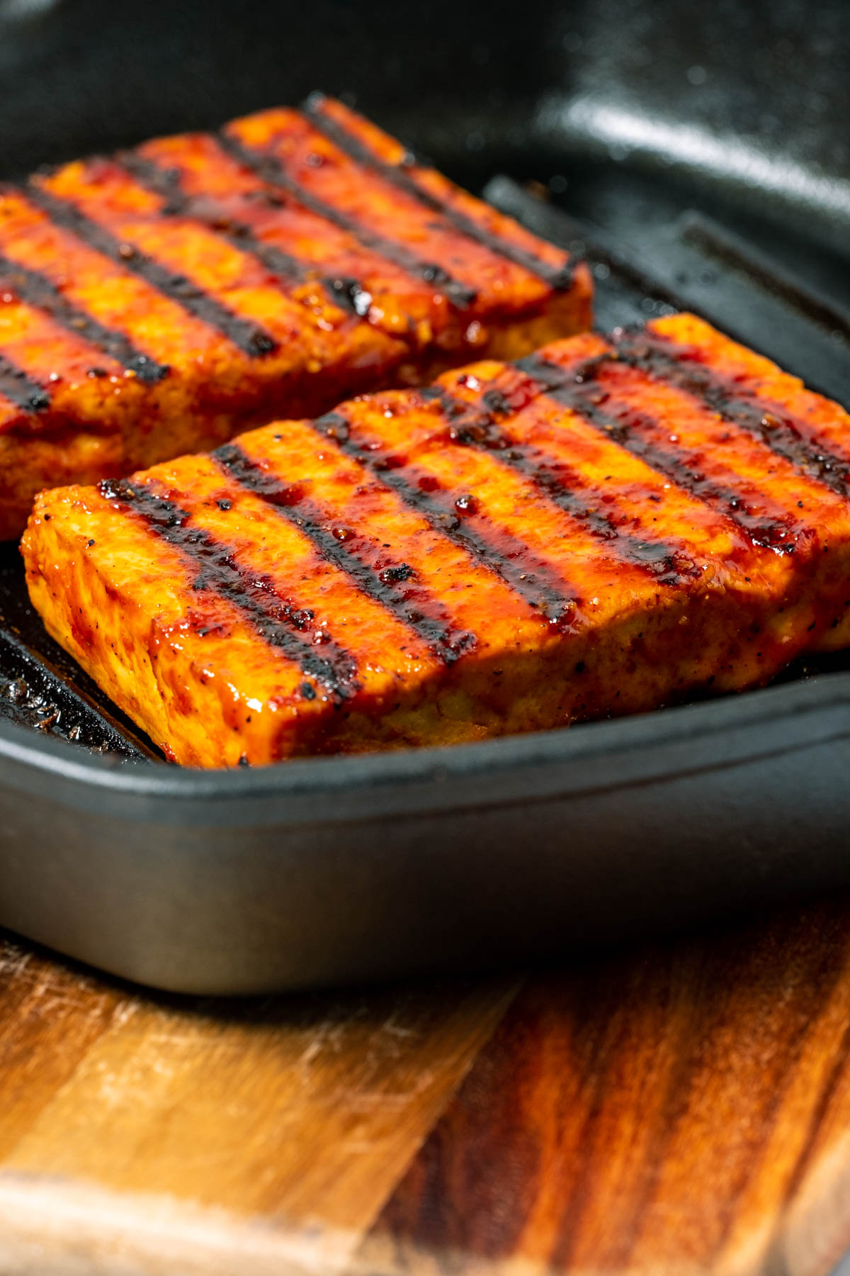 Tofu steaks in a cast iron grill pan.