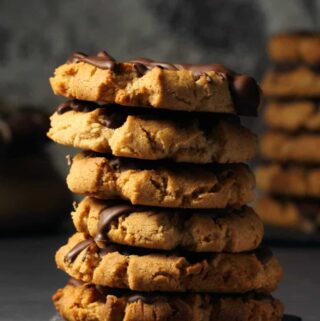 Vegan almond butter cookies in a stack.