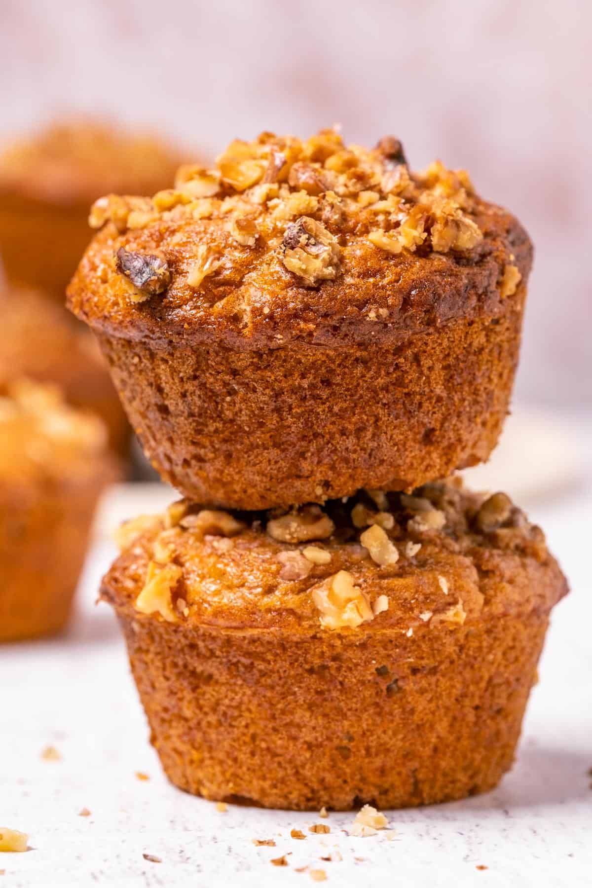 Stack of two banana bread muffins.