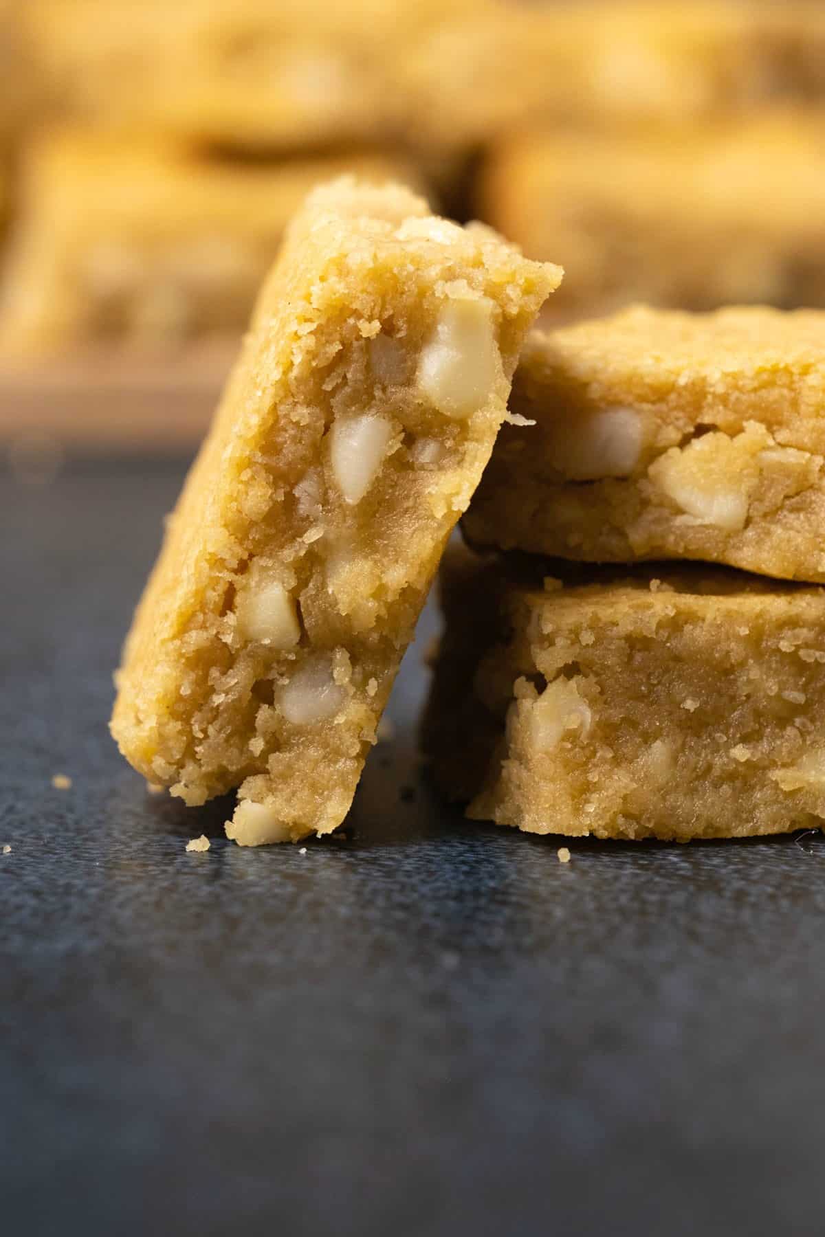 A blondie leaning against a stack of two blondies. 