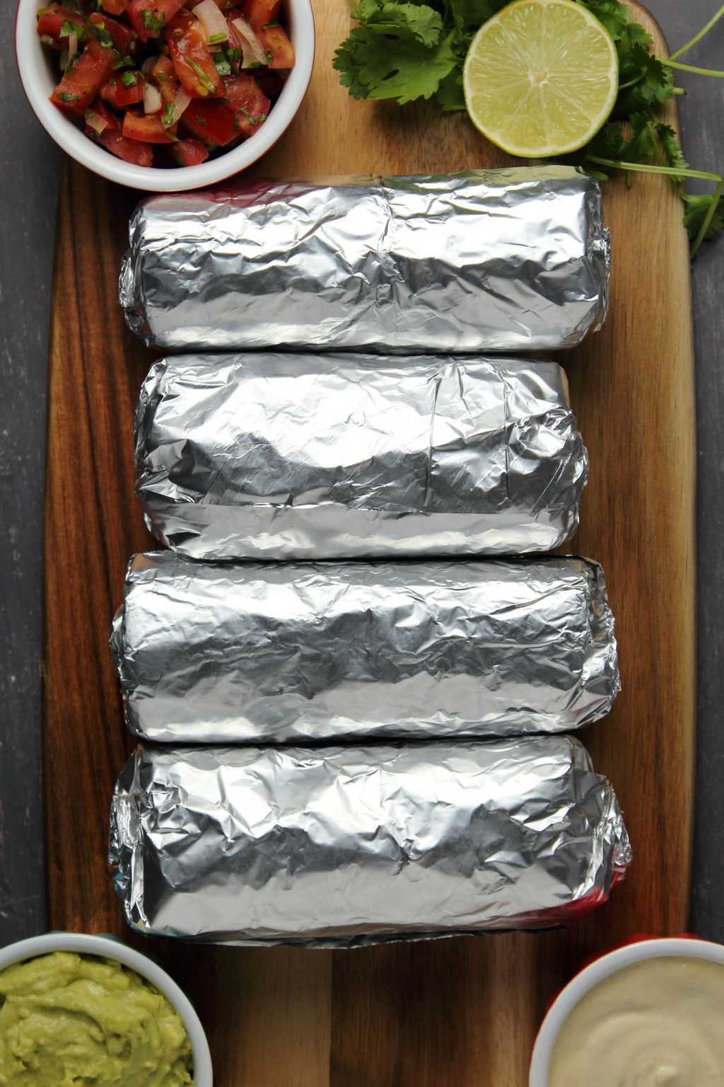 Vegan burritos wrapped in foil. 