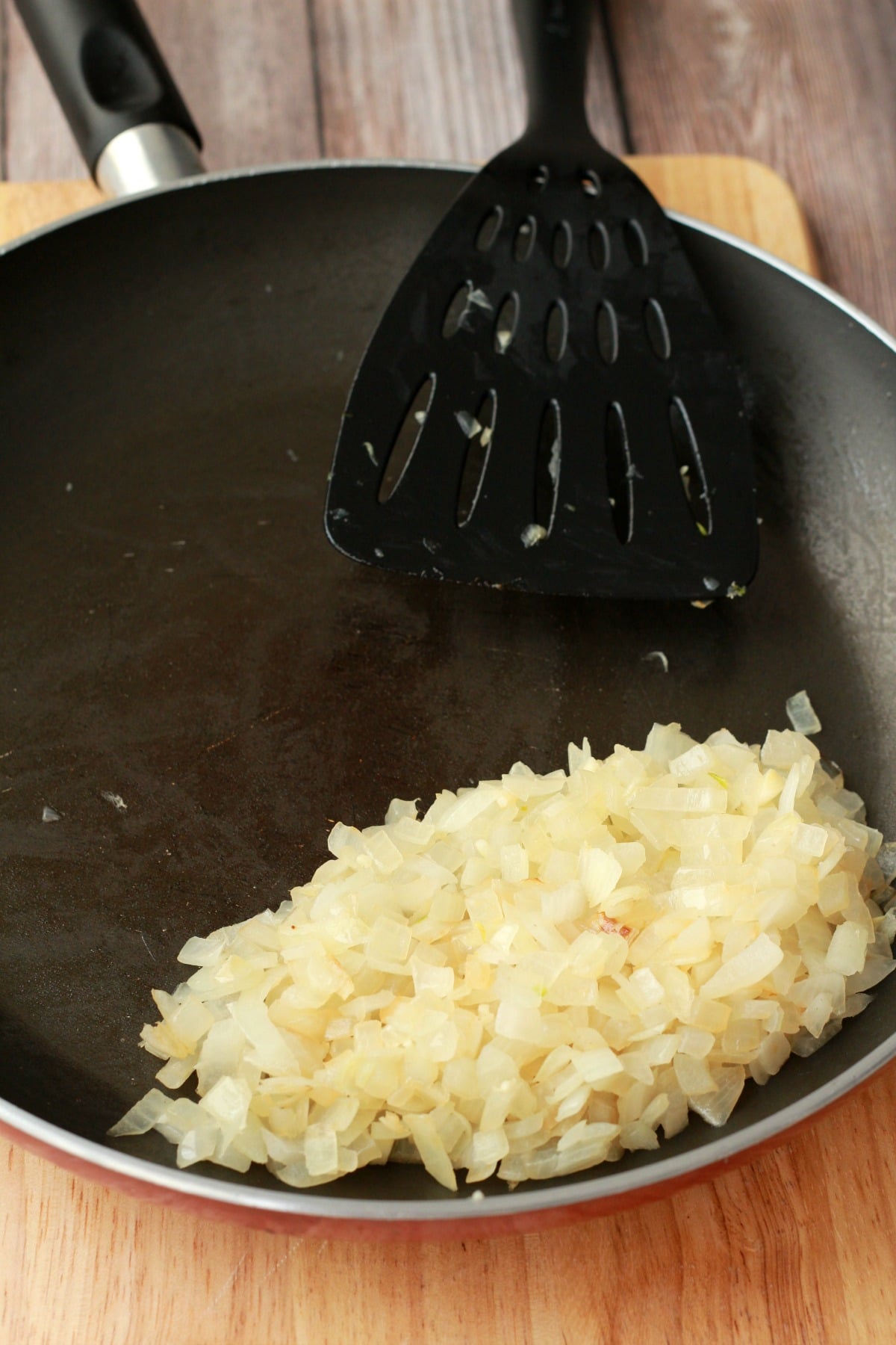 Onions and garlic frying in a pan. 