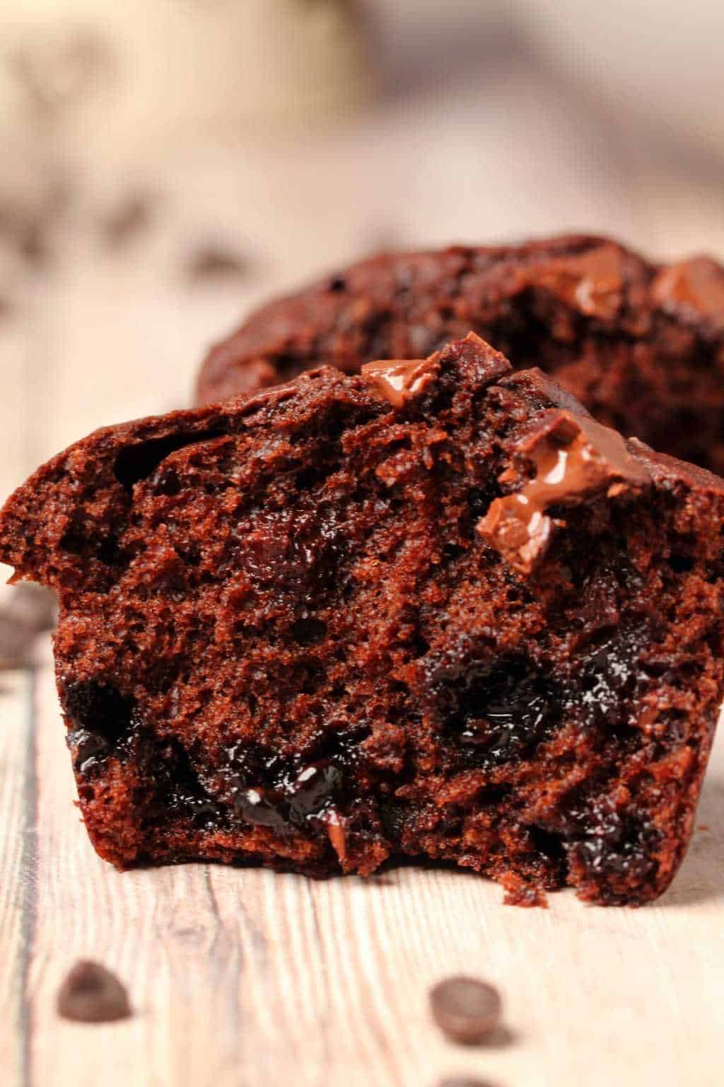 Chocolate muffin broken in half to show the center. 