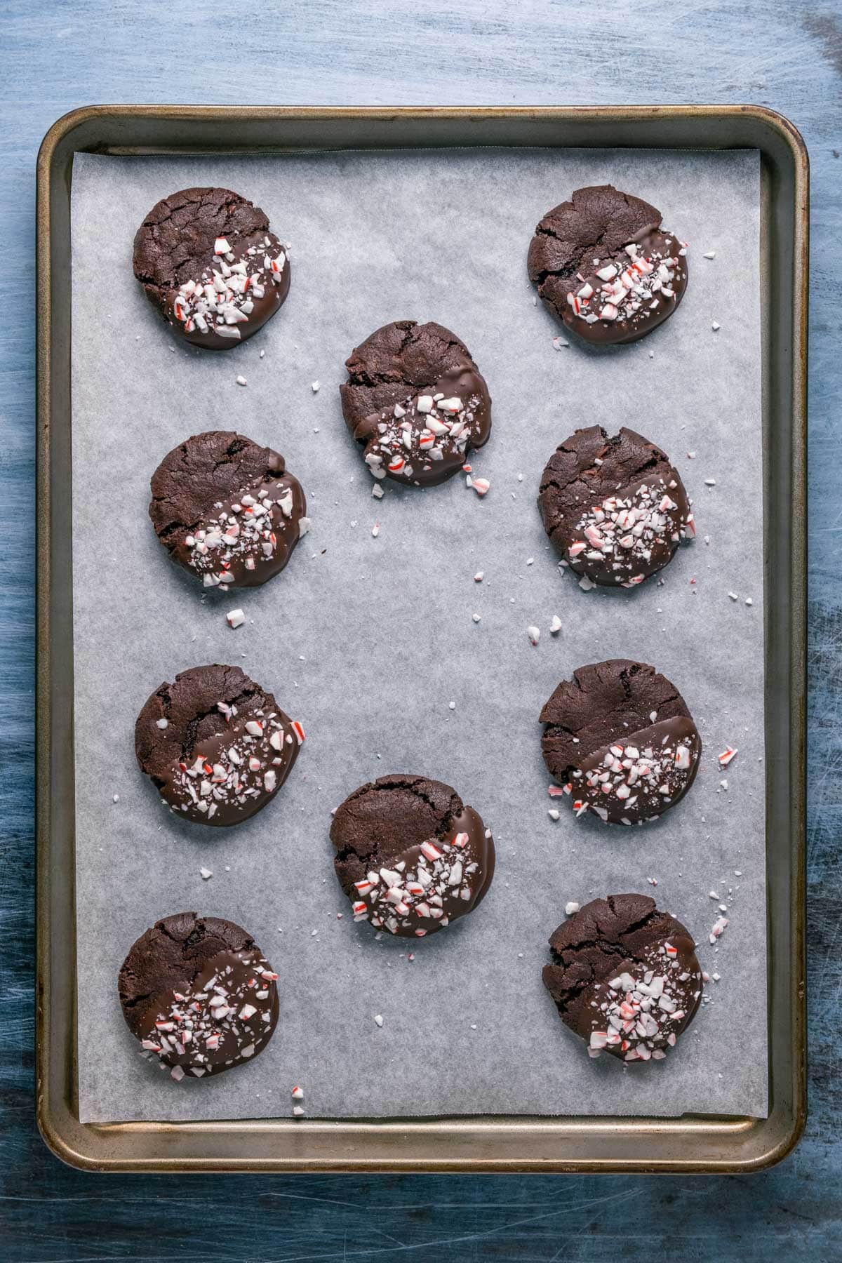 A tray of dipped vegan chocolate peppermint cookies