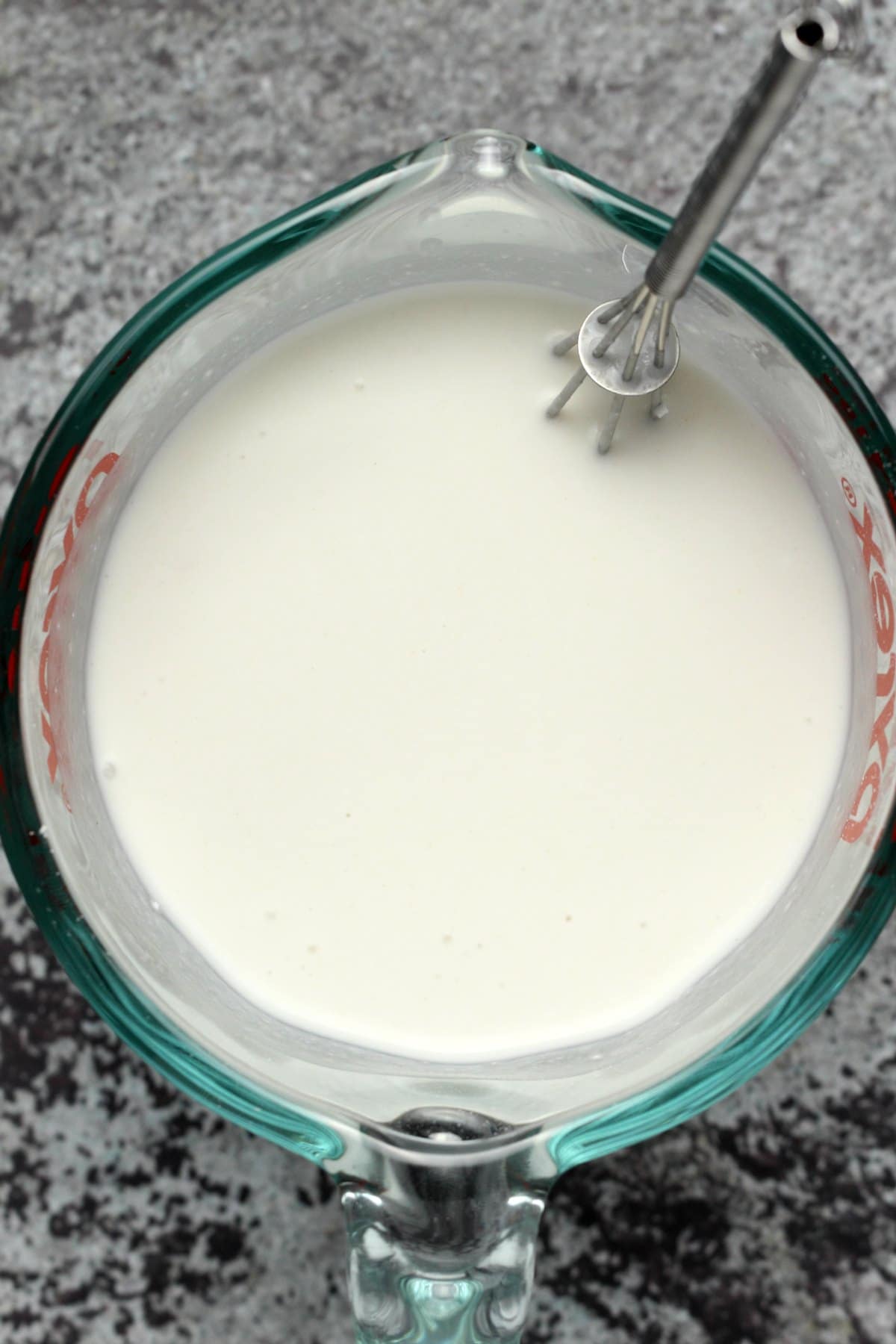 Cornstarch and coconut milk whisked up in a measuring jug.