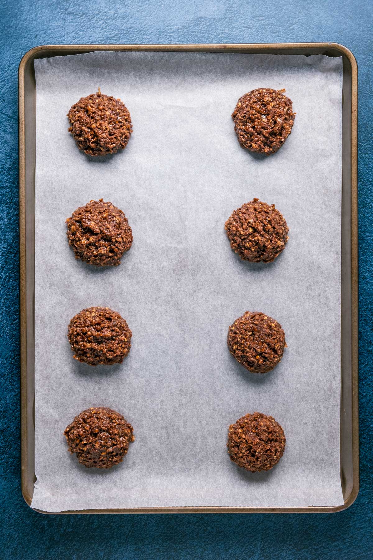 No bake cookies on a parchment lined baking sheet.