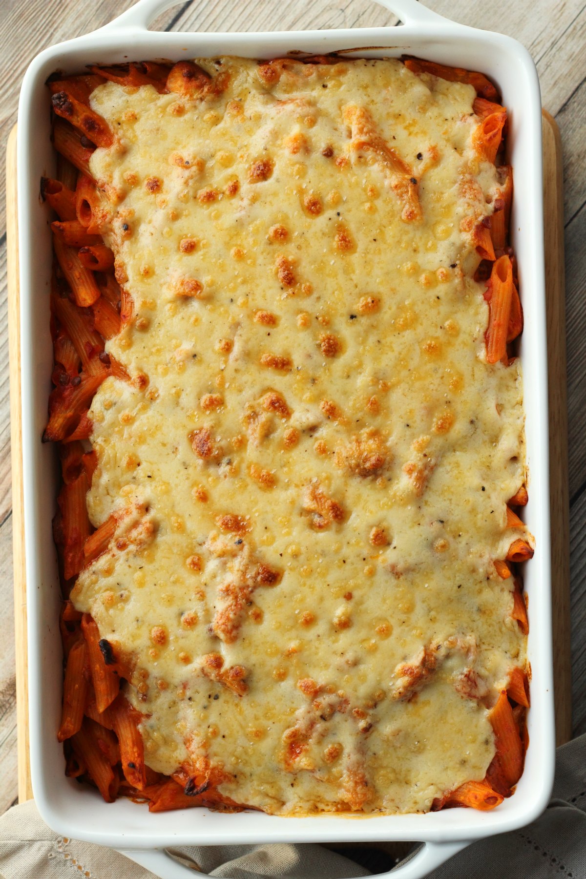 Vegan Pasta Bake straight out of the oven in a white oven dish. 