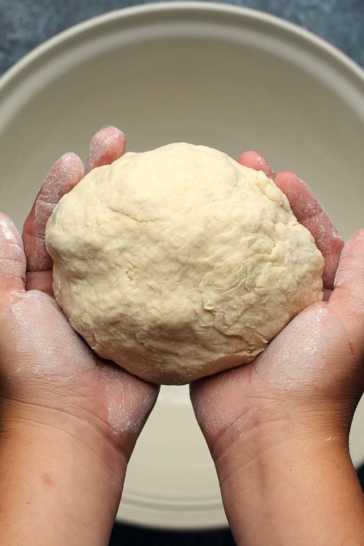 Kneading a ball of dough.