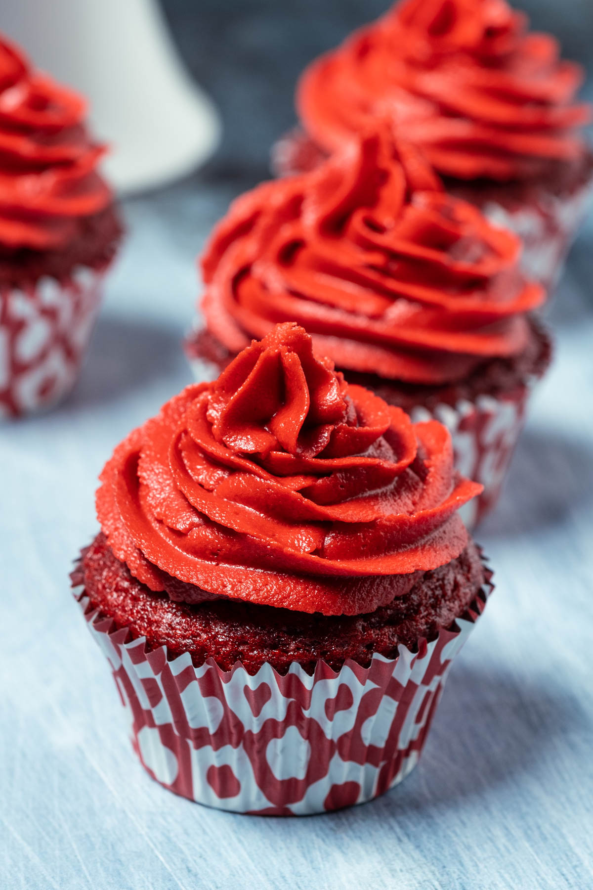 Vegan red velvet cupcakes in a row.  